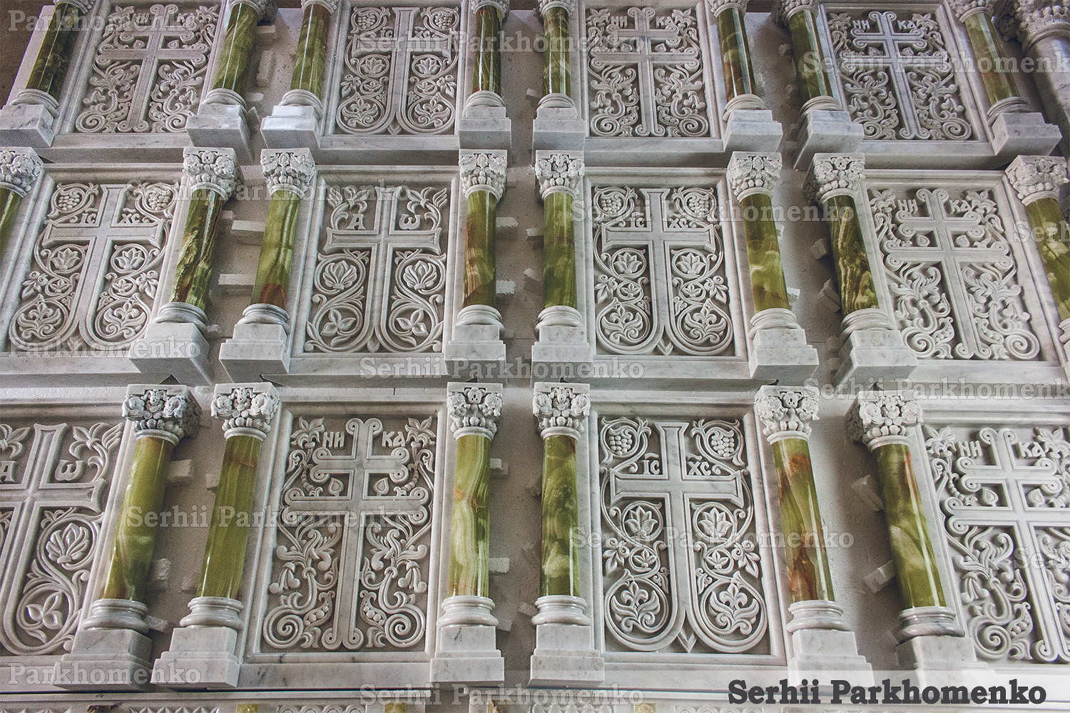 A monumental ensemble of finished white marble relief screens and genuine green onyx detailing for a church altar
