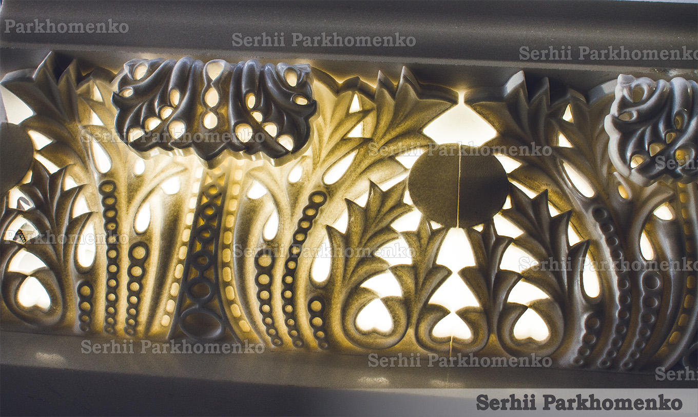 Close-up of a luxury backlit Thassos white marble cornice with intricate openwork carvings glowing from within by Serhii Parkhomenko's studio