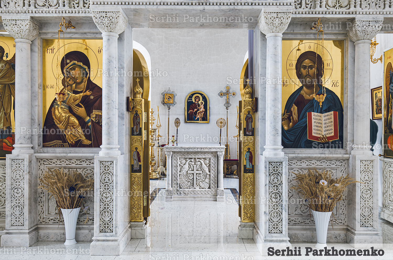 Sanctuary interior view showing the Mugla White marble Altar Table perfectly framed by a matching marble iconostasis screen at the Church of the Icon of the Mother of God