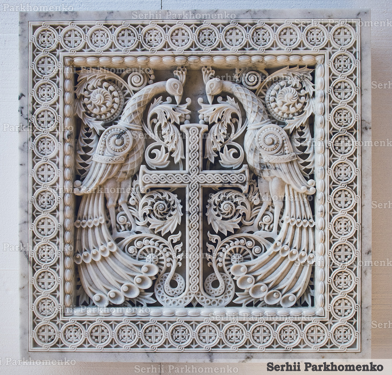 Front view of an intricately carved Mugla White marble relief panel featuring Byzantine peacocks and a blossomed cross by Serhii Parkhomenko's studio
