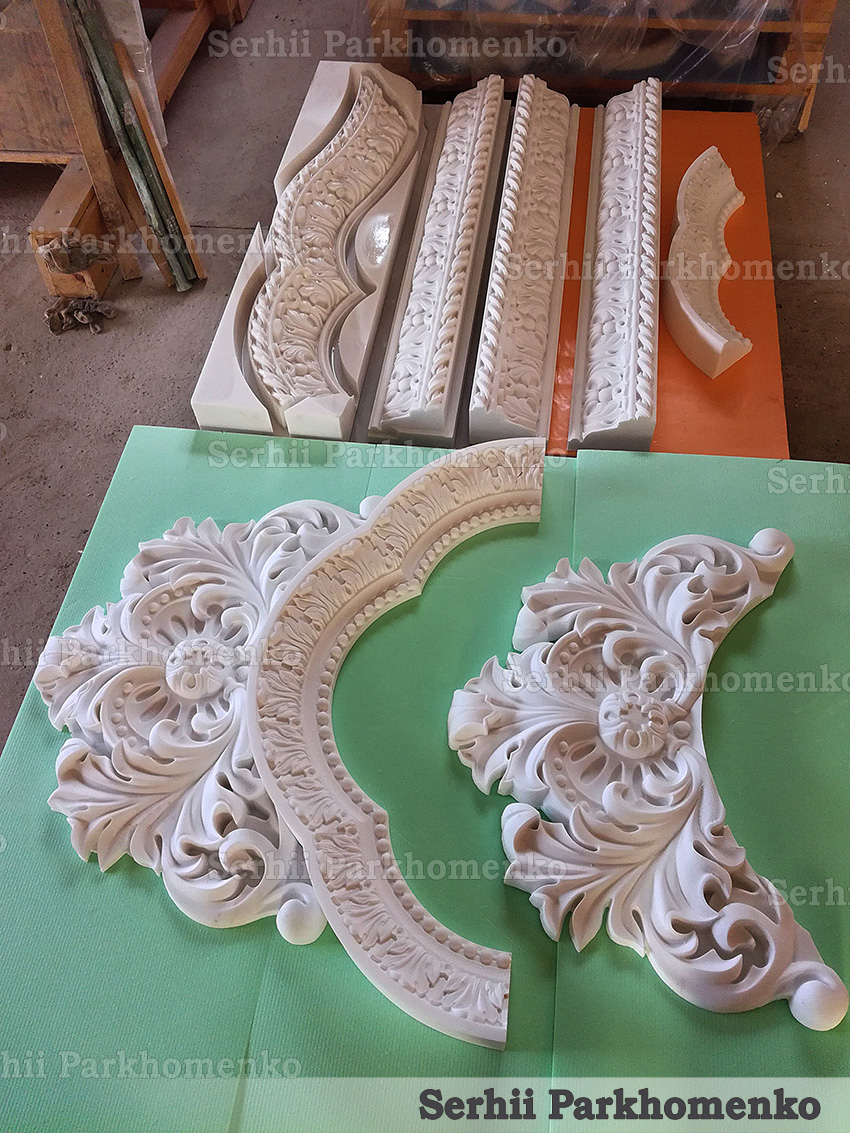 Bespoke architectural stone moldings, carved cornices, and decorative relief elements