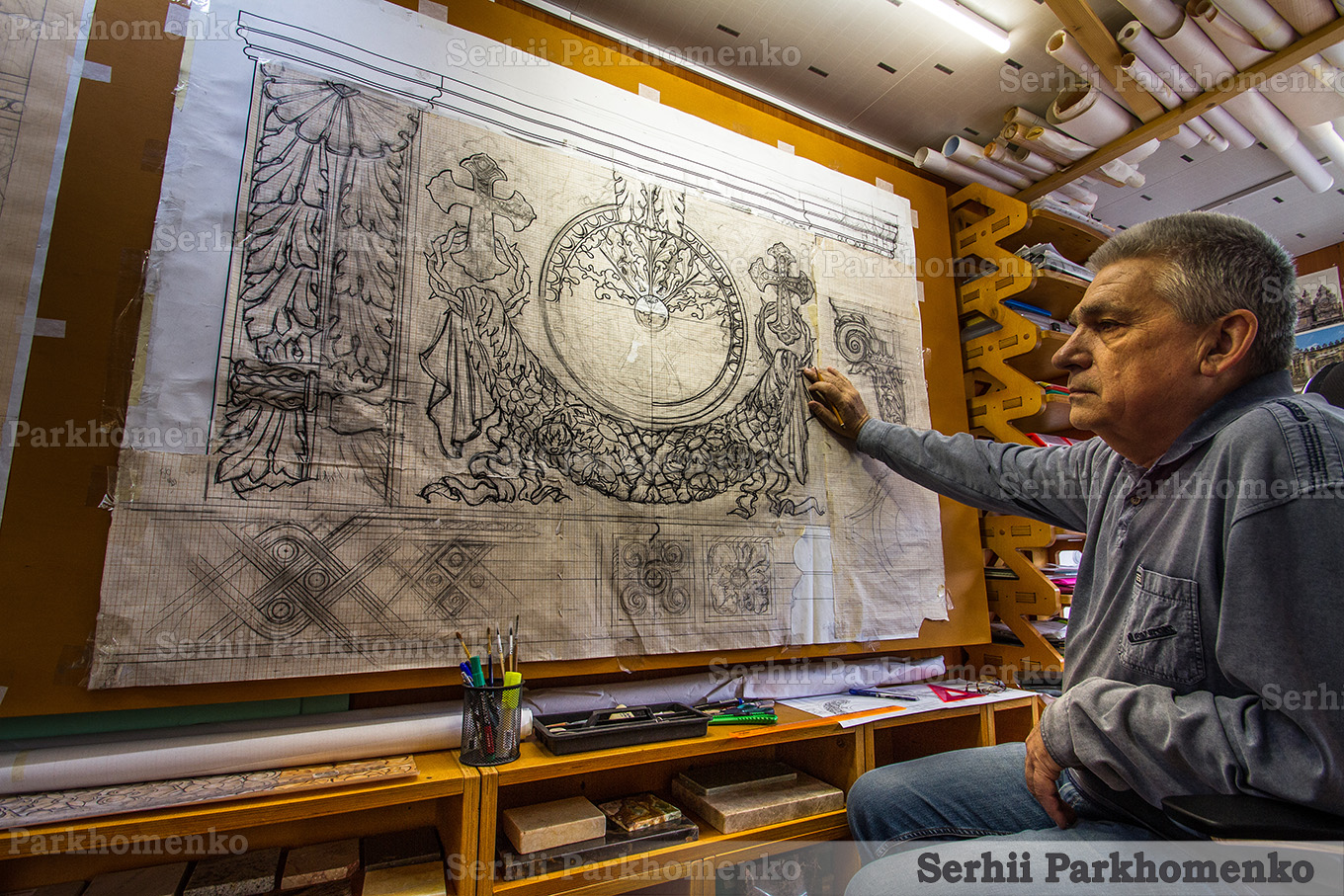 Evgeniy creating an intricate charcoal and pencil concept drawing for a custom church stone iconostasis
