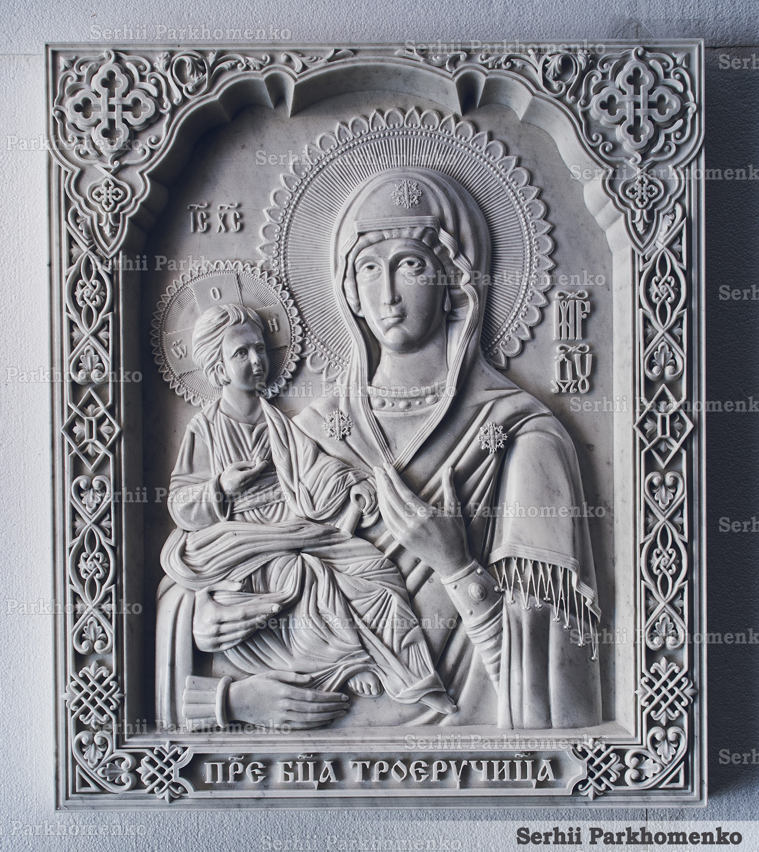 Front view of custom carved white marble icon of the Mother of God Of the Three Hands with Byzantine border by Serhii Parkhomenko