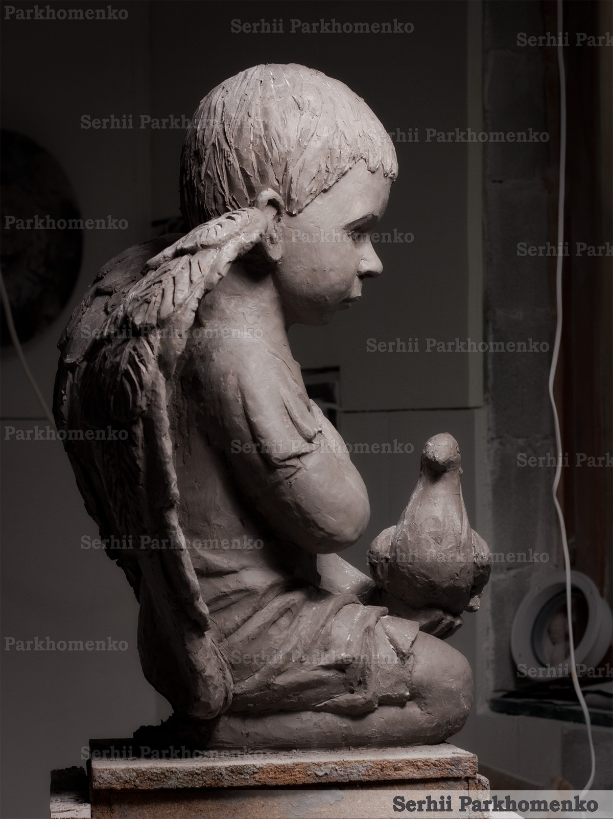 Side view profile of a handcrafted academic clay sculpture for stone carving visualization