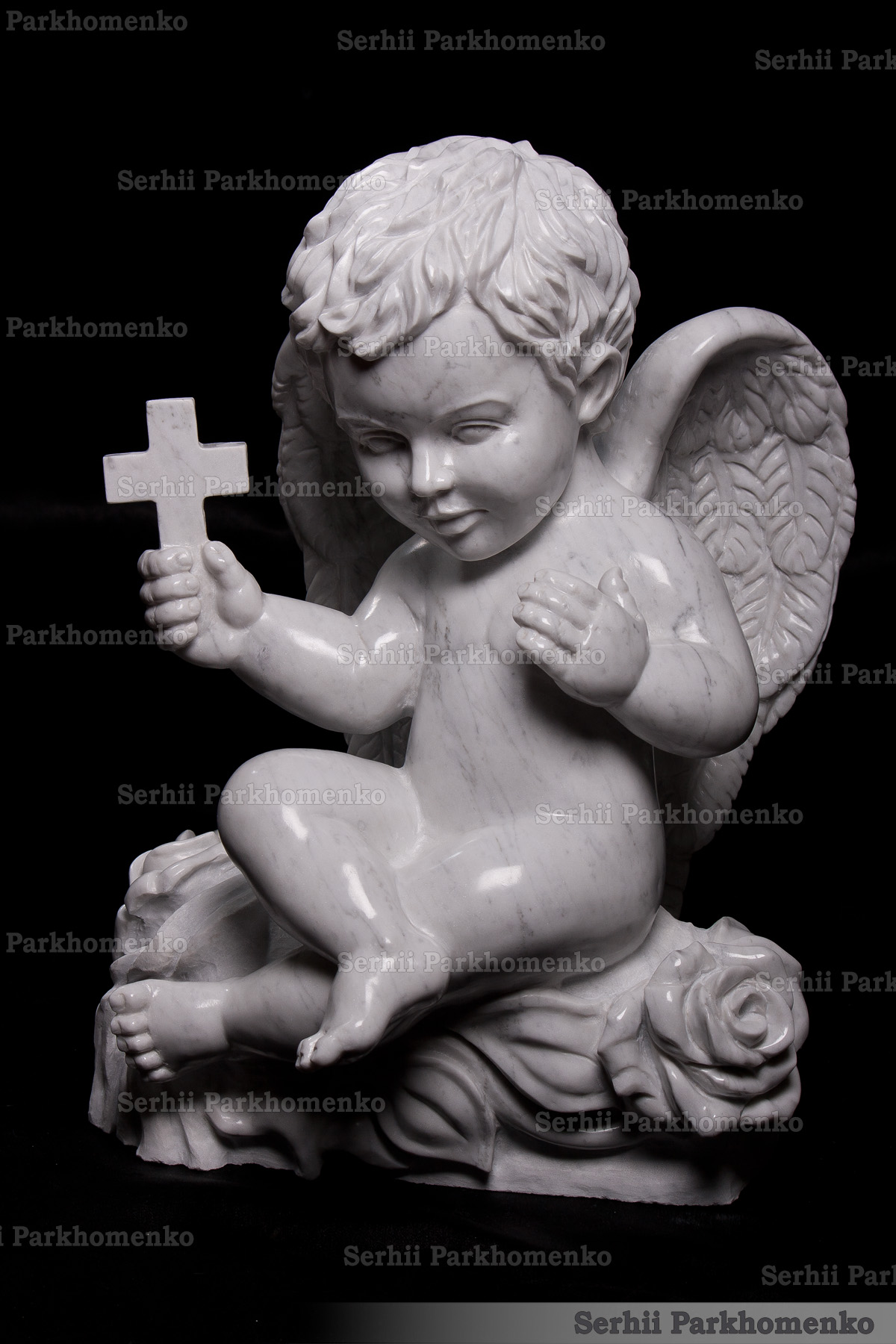 Classical Italian Carrara marble cherub statue with detailed wings and carved roses by Serhii Parkhomenko's Stone Architecture & Design Studio